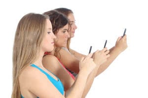 Group of teenager girls obsessed with the smart phone