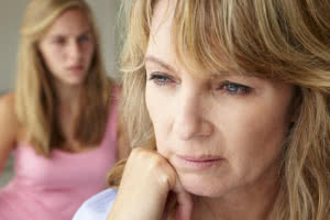 Unhappy mother with teenage girl
