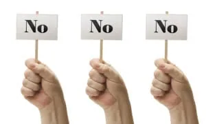 Three Signs In Fists Saying No, No and No