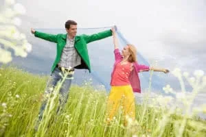 Young love Couple smiling under blue sky