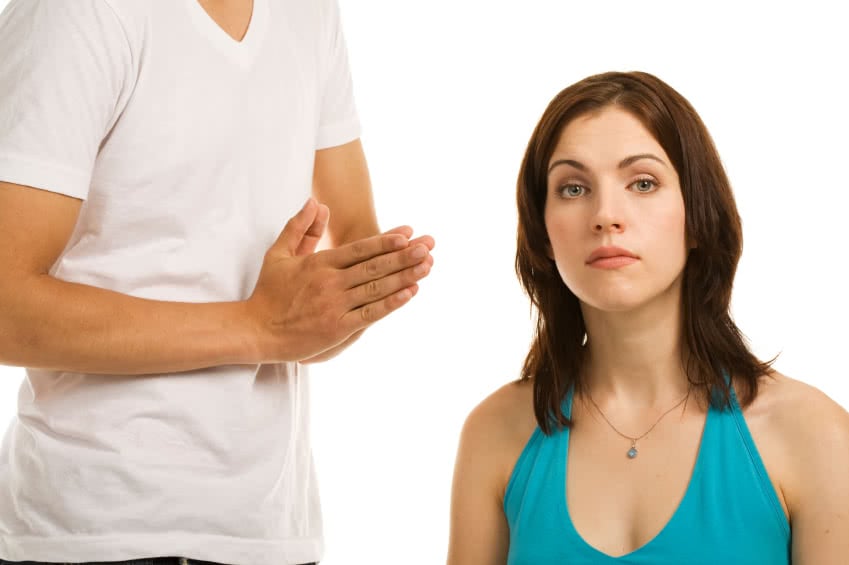 Young woman and young man showing different emotions. Concepts : pleading; disappointment; misunderstanding. White background.