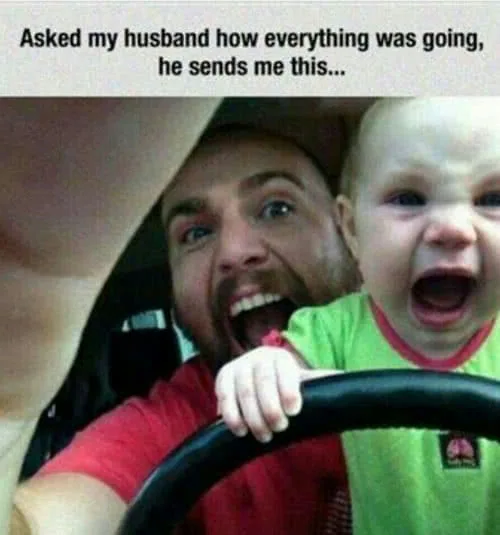 Man and young child making exaggerated excited screaming expressions while holding a steering wheel