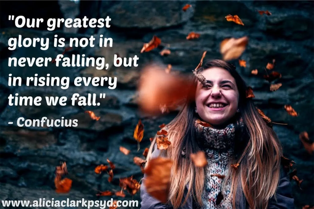 Smiling woman with falling autumn leaves and Confucius quote about resilience