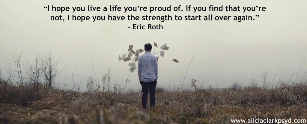 Person standing in bare field with papers floating upward, Eric Roth quote about living a proud life and starting over