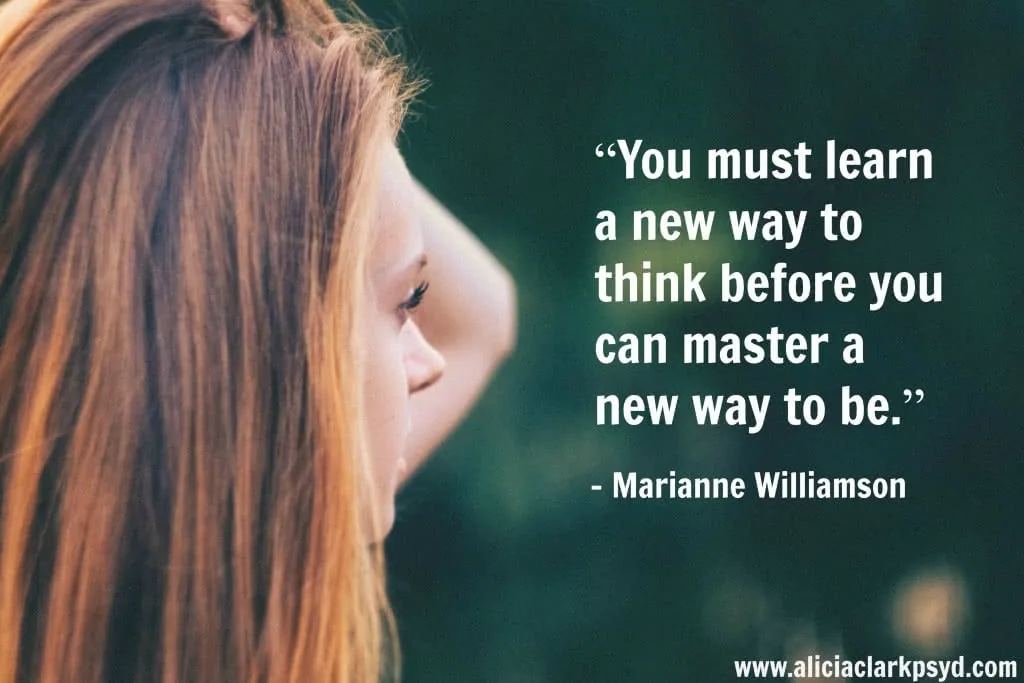 Profile of woman with long hair against green background with motivational quote about learning new ways of thinking