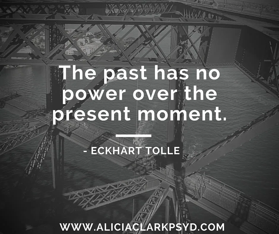 Black and white image of bridge architecture with Eckhart Tolle quote about the present moment