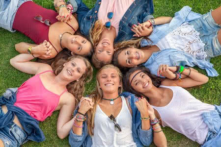 36452257 - happy smiling group of diverse girls at summer camp