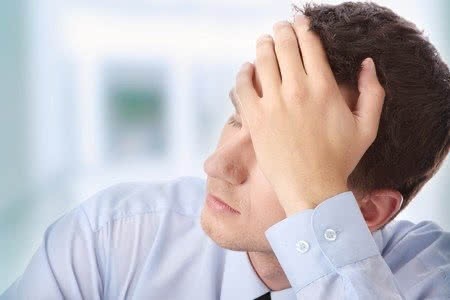 7821098 - businessman in depression with hand on forehead
